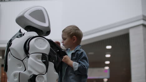 Humanoid-robot-talks-with-child-at-technology-exhibition.-The-Exhibition-Park-Of-Robots.-Humanoid-robot-talks-with